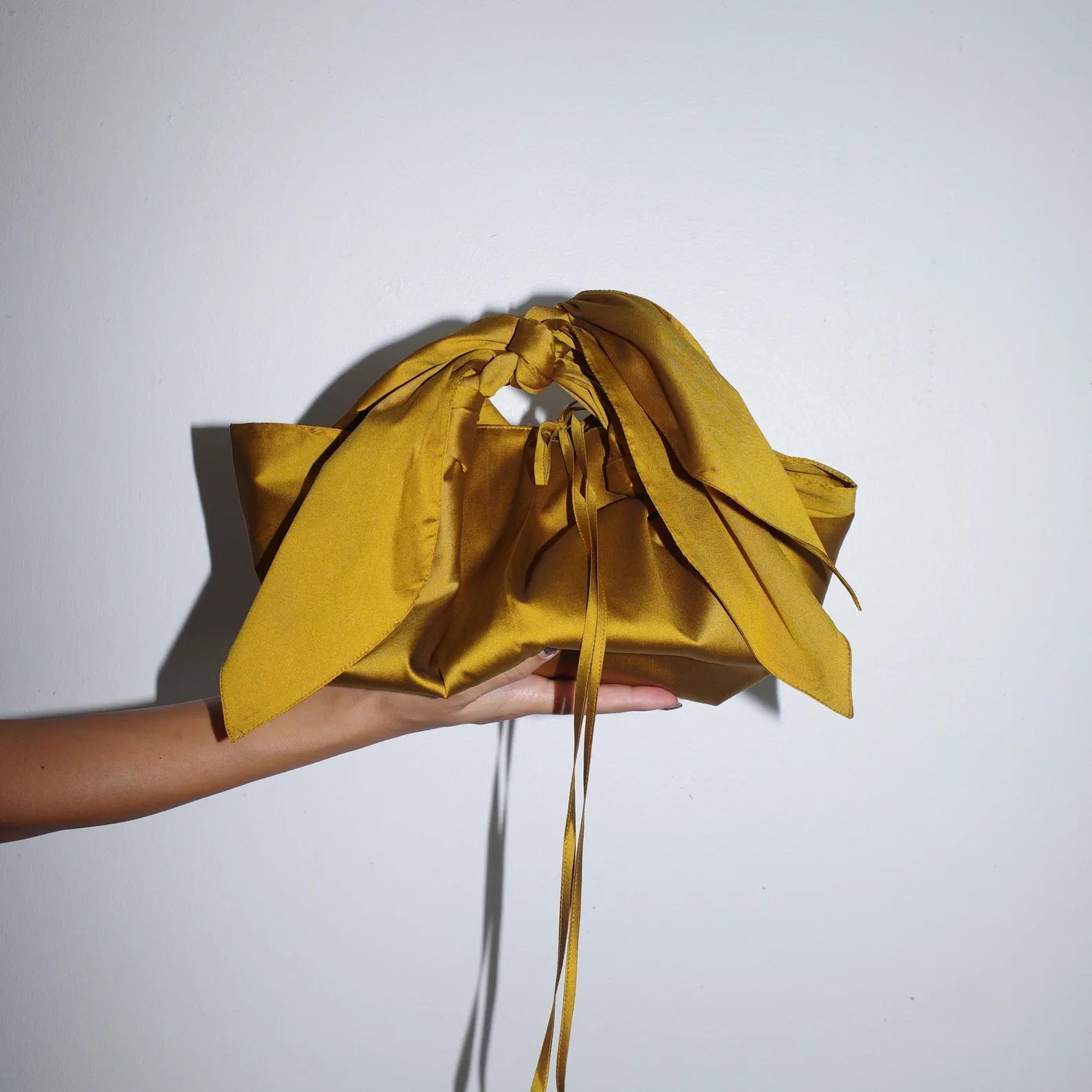 Golden Mustard Knot Drawstring Wrist Bag